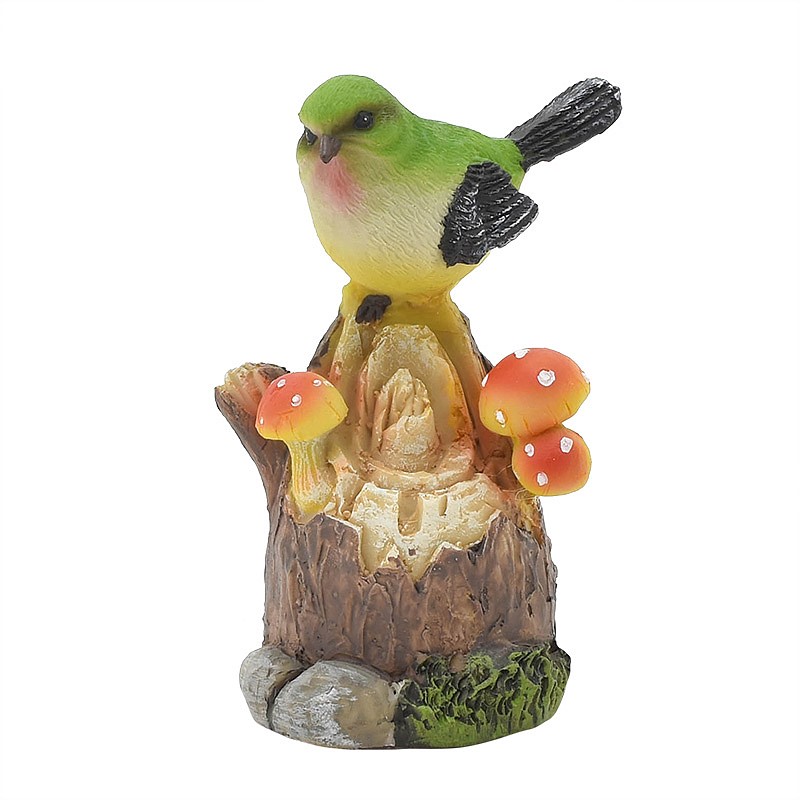 Oiseau siffleur sur tronc