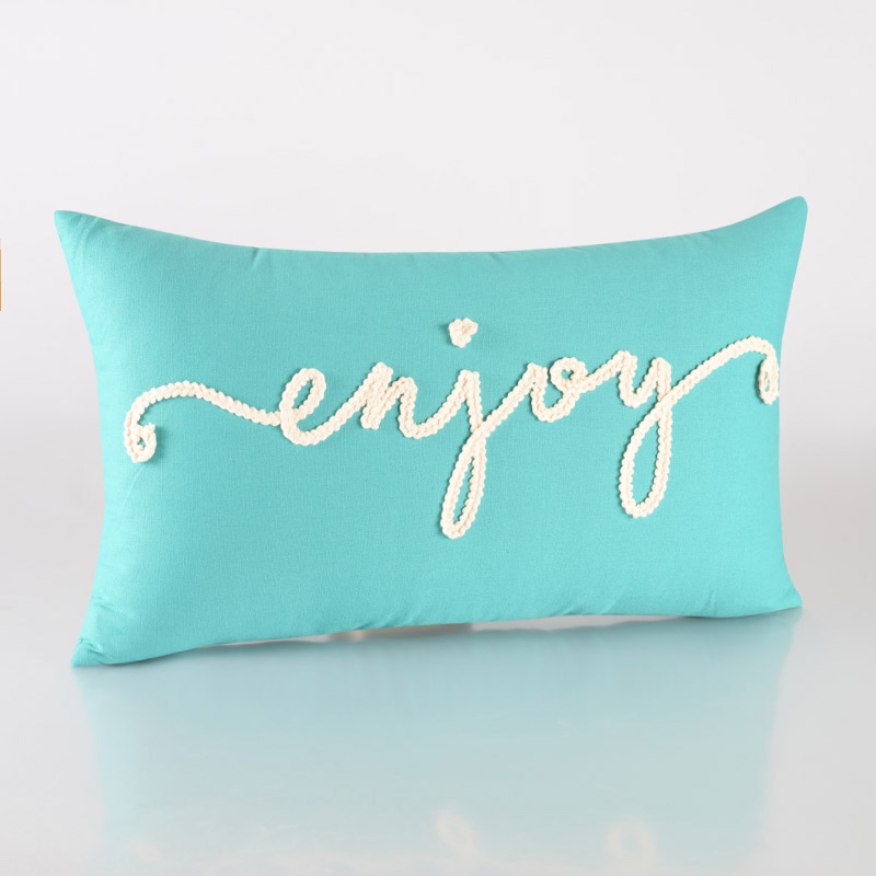 Coussin broderie 'Enjoy'