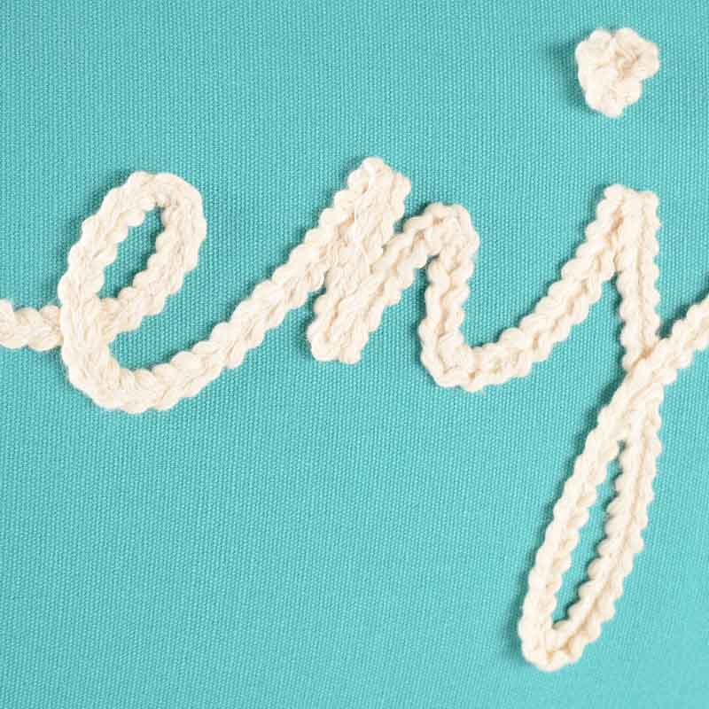 Coussin broderie 'Enjoy'