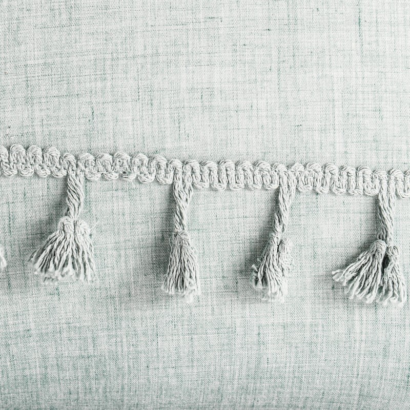 Coussin avec pompons 'Camille' bleu