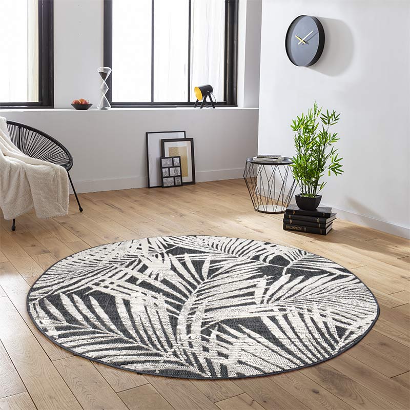 Tapis rond feuillage tissé