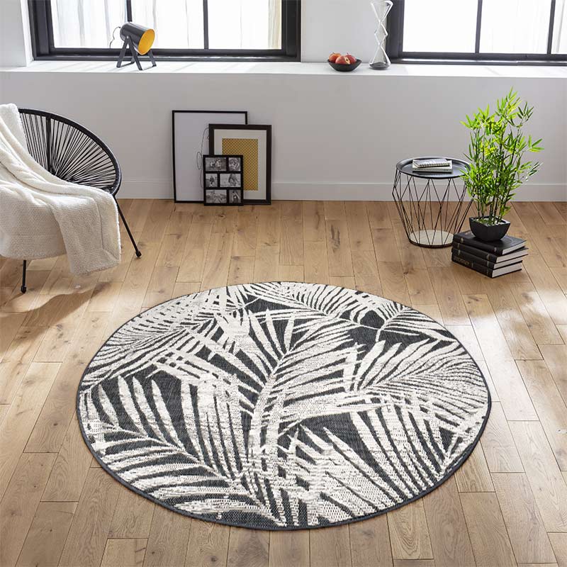 Tapis rond feuillage tissé