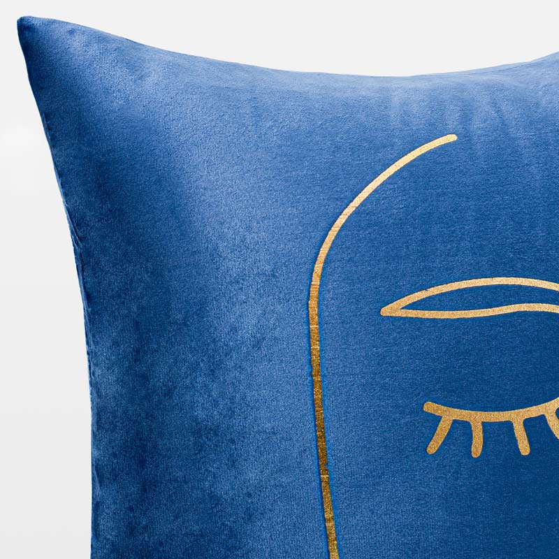 Coussin visage 'Faciès' bleu et or