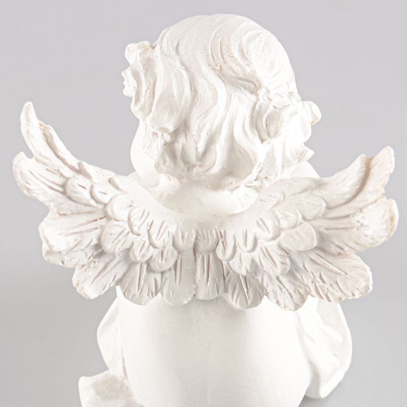 Figurine d'un ange assis blanc