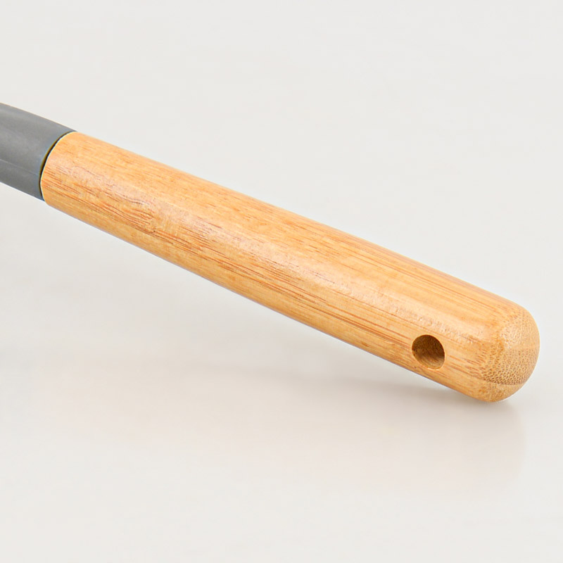 Brosse avec manche grise