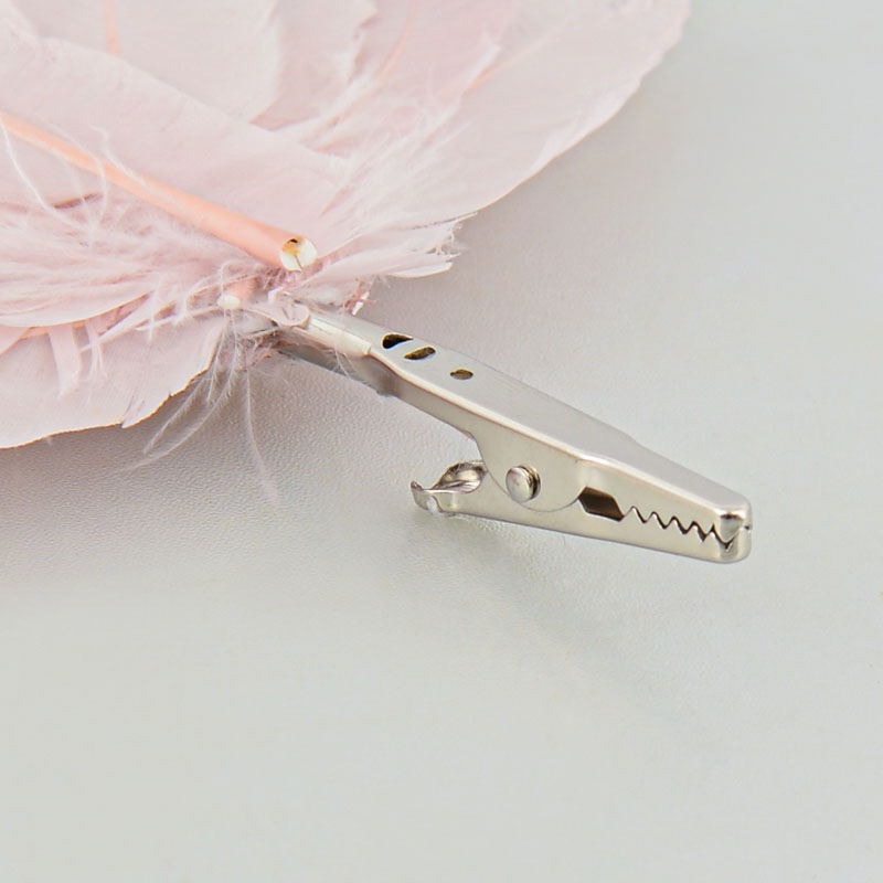Plume rose avec pince 