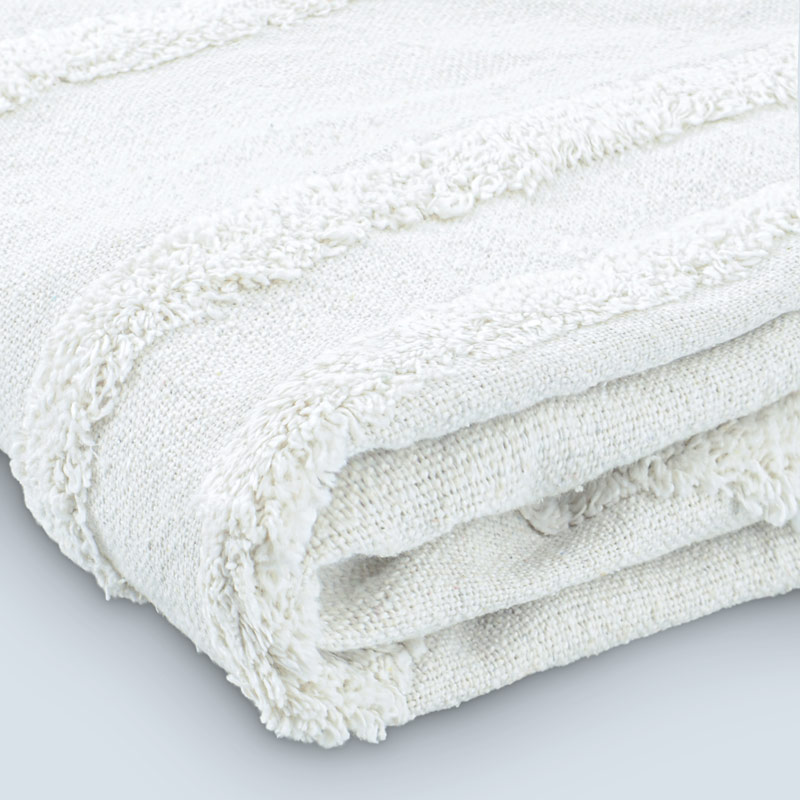 Plaid 'Edwin' en coton tufté avec pompons