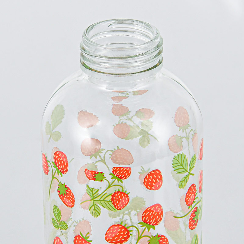 Bouteille motifs fraises en verre 