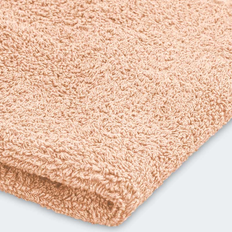 Serviette invité 'Loca' couleur pêche